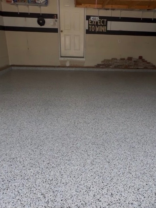 Finished flake epoxy garage floor after coating, toward the back wall