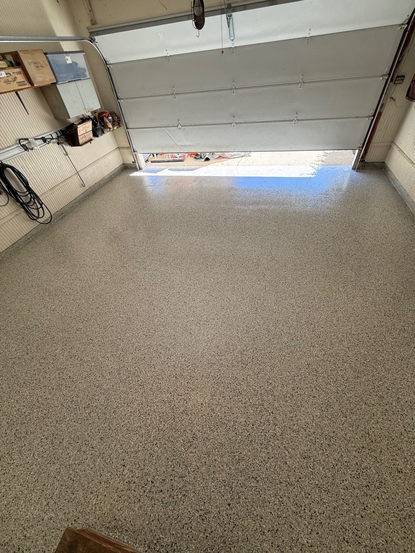 Speckled flake epoxy garage floor after coating, inside the garage